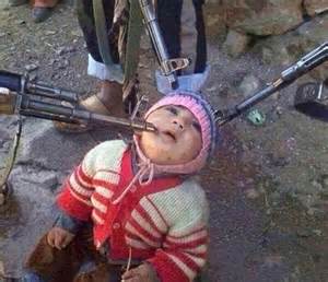 Baby about to be murdered by ISIS soldiers.